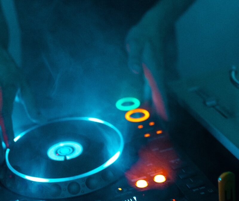 person using DJ turntable