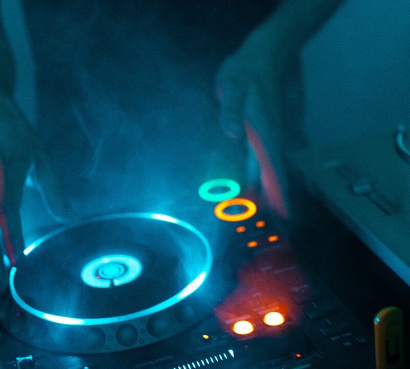 person using DJ turntable