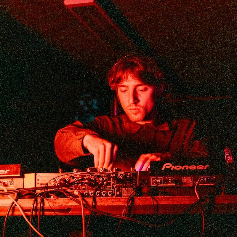 woman in black long sleeve shirt playing audio mixer