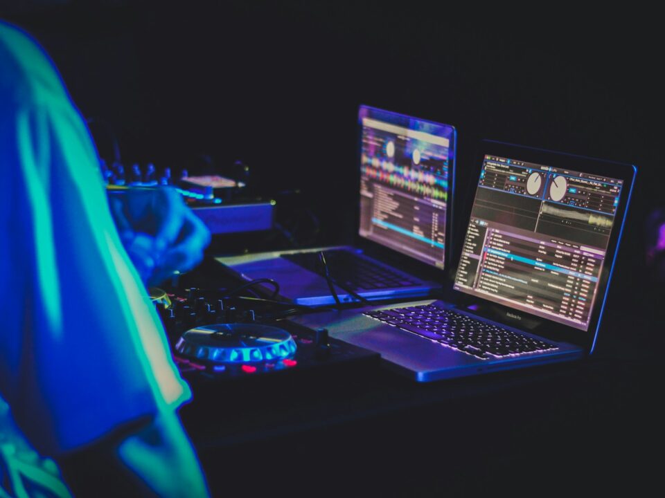 two laptop computers and DJ turntables