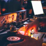 person holding black and grey DJ turntable