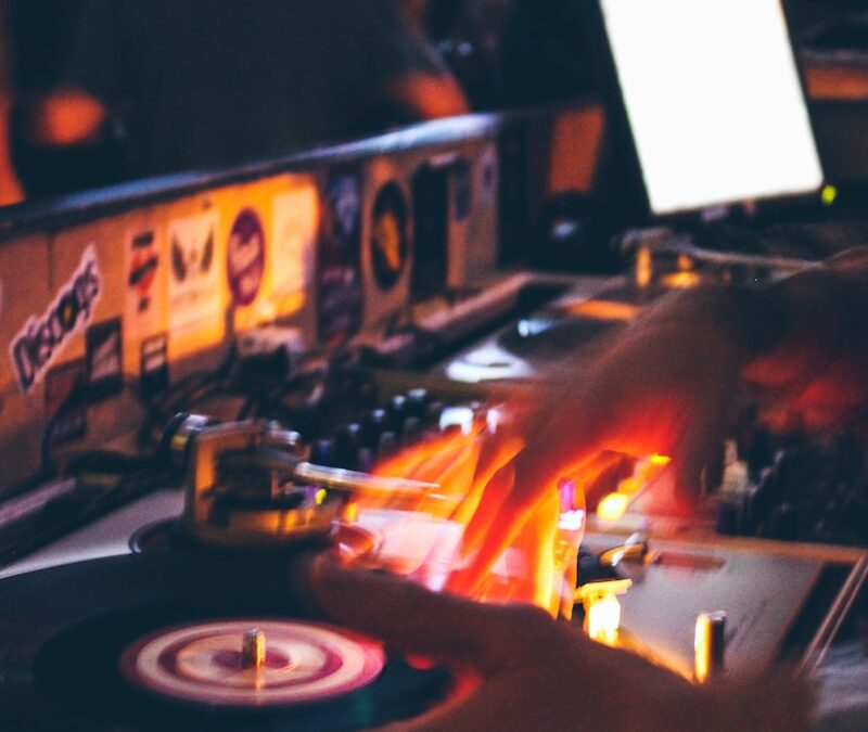 person holding black and grey DJ turntable